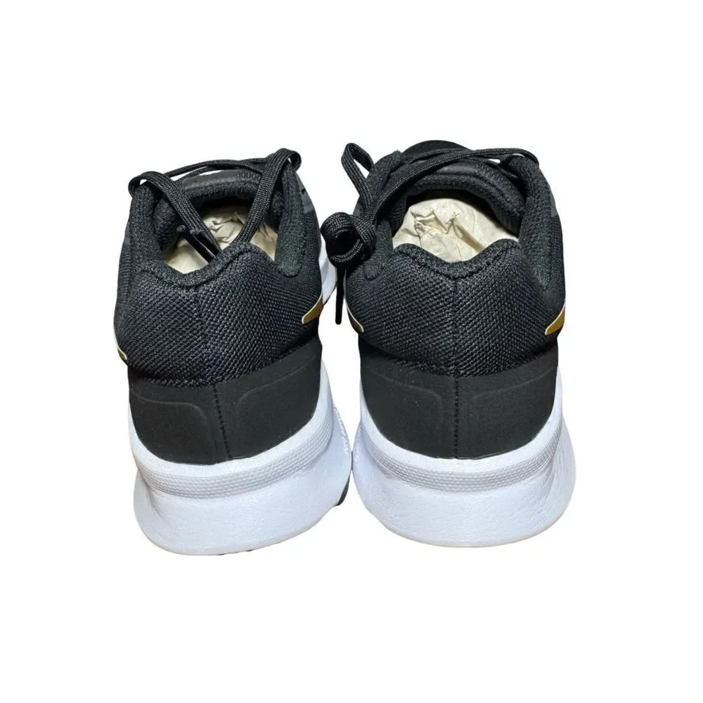 Nike women’s Black and Gold Running Shoes size 6.5